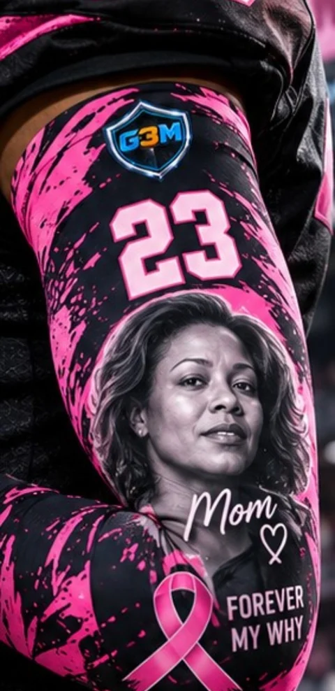 Close-up of a G3M Pink Series custom football compression sleeve with pink ribbon tribute design, jersey number 23, G3M logo, and memorial portrait